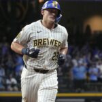 Andrew Vaughn swinging a bat – 2026 fantasy baseball waiver wire must-add player.