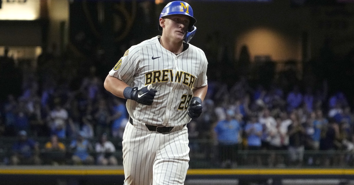 Andrew Vaughn swinging a bat – 2026 fantasy baseball waiver wire must-add player.